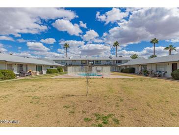 Community pool and courtyard with surrounding buildings at 4325 N 26Th St # 12, Phoenix, AZ 85016