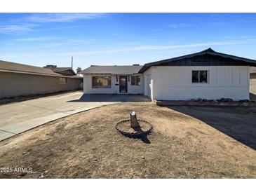 Charming single story home with a well-maintained front yard at 4511 W Cavalier Dr, Glendale, AZ 85301