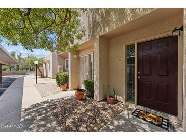 Inviting condo entryway with well-manicured landscaping and a welcoming doormat at 832 W 14Th St, Tempe, AZ 85281