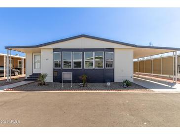 Updated mobile home exterior boasts modern design and landscaping at 11596 W Sierra Dawn Blvd # 109, Surprise, AZ 85378