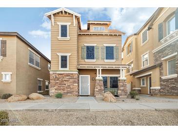 Beautiful two-story home with stone accents and a welcoming front porch at 3039 W Sand Flower Dr, Phoenix, AZ 85086