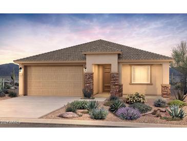 Single-story home with a two-car garage and desert landscaping at 32359 N 19Th Ln, Phoenix, AZ 85085