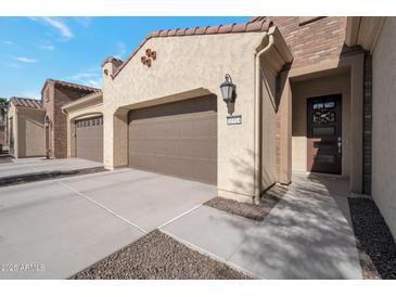 Inviting exterior of a two-story home with a modern design and attached garage at 16914 W Merrell St, Goodyear, AZ 85395