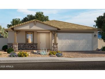 Single-story home with a two-car garage and stone accents at 17803 W Elm St, Goodyear, AZ 85395