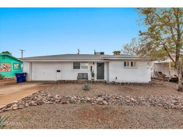 Charming single story home with a well-maintained front yard at 2087 E 10Th St, Tempe, AZ 85281