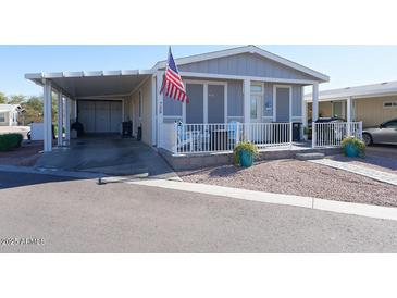 Single-story home with carport, patio, and landscaped yard at 2206 S Ellsworth Rd # 72B, Mesa, AZ 85209