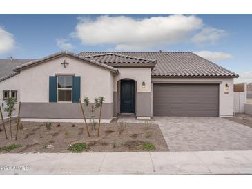 Single-story home with gray exterior, tile roof, and a 2-car garage at 2732 N 217Th Ave, Buckeye, AZ 85396