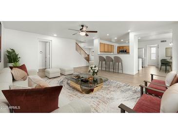 Bright living room with hardwood floors and comfortable seating at 3552 E Claxton Ave, Gilbert, AZ 85297