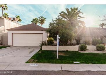 Charming home featuring desert landscaping and a two-car garage at 5121 W Jupiter Way, Chandler, AZ 85226