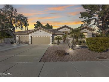 Beautiful two-story home with a three-car garage and desert landscaping at 7132 W Villa Chula --, Glendale, AZ 85310