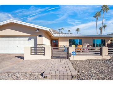 Updated mid-century modern home with new landscaping and gated entry at 7501 N 22Nd Pl, Phoenix, AZ 85020