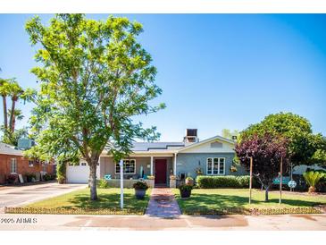 Charming single story home with landscaped lawn and walkway at 2157 W Mulberry Dr, Phoenix, AZ 85015