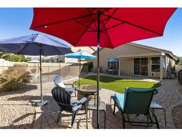 Backyard with fire pit and seating area at 1918 E Saratoga St, Gilbert, AZ 85296