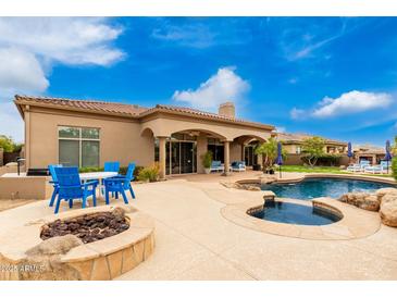 Luxury backyard oasis with pool, spa, and fire pit at 20546 N 83Rd Pl, Scottsdale, AZ 85255