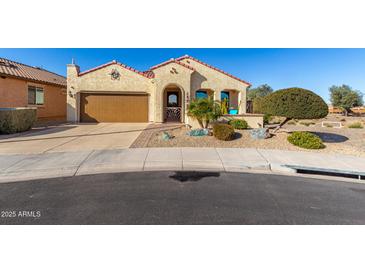 Single-story home with desert landscaping and a two-car garage at 21268 N 266Th Ln, Buckeye, AZ 85396