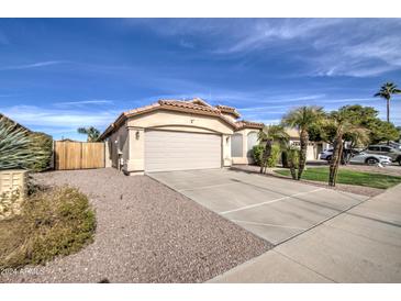 Single-story home with attached garage and landscaped front yard at 4710 E Torrey Pines Ln, Chandler, AZ 85249