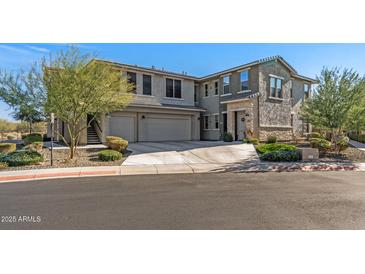 Two-story townhome with attached two-car garage and landscaped front yard at 5100 E Rancho Paloma Pkwy # 1014, Cave Creek, AZ 85331