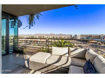 Spacious balcony with city views and comfortable seating at 7180 E Kierland Blvd # 516, Scottsdale, AZ 85254