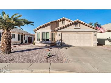 Cute one-story home with a two-car garage and desert landscaping at 10642 W Mohawk Ln, Peoria, AZ 85382