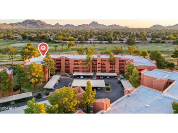 Aerial view of a condo complex with mountain views and surrounding landscape at 12212 N Paradise Village S Pkwy # 134, Phoenix, AZ 85032