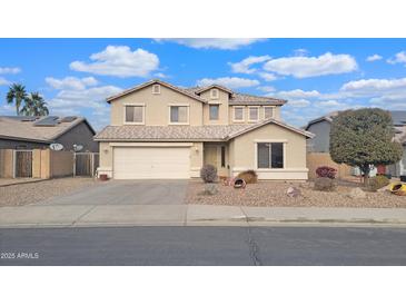 Two-story house with a large yard and a two-car garage at 12618 W Catalina Dr, Avondale, AZ 85392