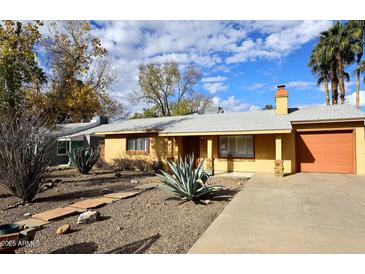 Single story home with landscaped yard at 1312 E Coolidge St, Phoenix, AZ 85014