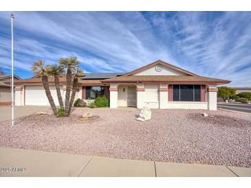 Single-story home with desert landscaping and a two-car garage at 14702 W Buttonwood Dr, Sun City West, AZ 85375