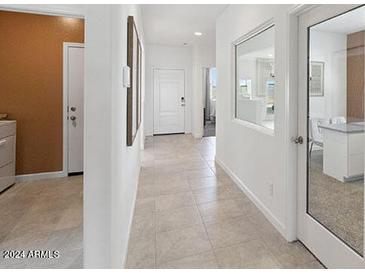 Bright hallway with tile flooring and access to other rooms at 1649 N Fenway Dr, Florence, AZ 85132