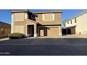 Two-story house with a two-car garage and landscaped front yard at 2826 E Augusta Ave, Chandler, AZ 85249