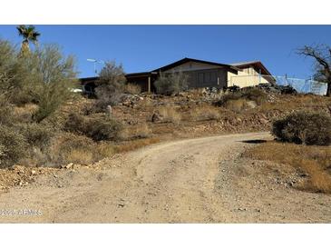 Ranch style home with carport and desert landscaping at 42213 N 3Rd St, Phoenix, AZ 85086