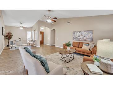 Spacious living room with hardwood floors and a comfortable seating area at 710 S Monterey St, Gilbert, AZ 85233