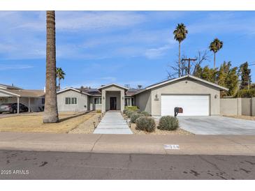 Attractive single-story home with landscaped front yard and walkway at 740 W Tuckey Ln, Phoenix, AZ 85013