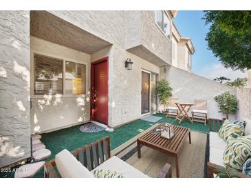 Cozy patio area featuring outdoor seating and a stylish rug, perfect for relaxing and entertaining guests at 2121 S Pennington Rd # 12, Mesa, AZ 85202