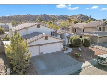 Nice two-story house with a three-car garage and a landscaped yard at 2705 E Verbena Dr, Phoenix, AZ 85048