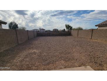 Large gravel backyard with block wall at 11215 W Heatherbrae Dr, Phoenix, AZ 85037