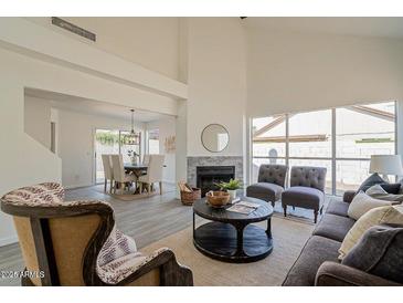 Bright living room with fireplace and ample natural light at 19241 N 4Th Pl, Phoenix, AZ 85024