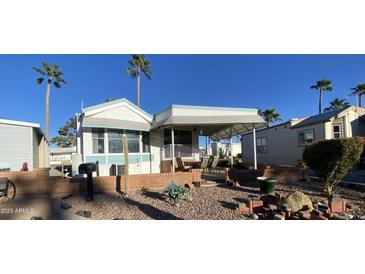 Single-wide manufactured home with covered patio and desert landscaping at 2271 S Seminole Dr, Apache Junction, AZ 85119