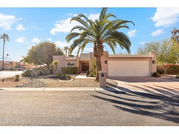 Desert landscaping enhances this single-level home's curb appeal at 26034 S Glenburn Dr, Sun Lakes, AZ 85248