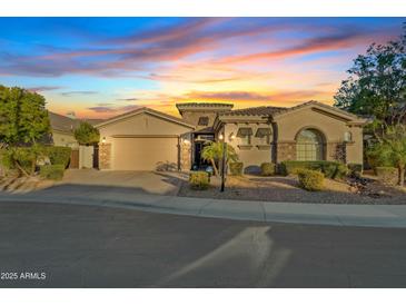 Beautiful two-story home with a three-car garage and desert landscaping at 5045 S Mingus Pl, Chandler, AZ 85249