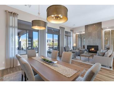 Spacious dining area with large windows and a view of the backyard at 9740 E Lofty Point Rd, Scottsdale, AZ 85262