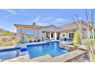 Inviting pool and spa with waterfall feature at 9740 E Lofty Point Rd, Scottsdale, AZ 85262