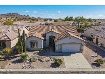 Single-story home with desert landscaping and a two-car garage, aerial view at 5363 S Emerald Desert Dr, Gold Canyon, AZ 85118