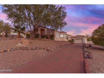 Brick paved pathway leads to a charming house with desert landscaping at 15859 N Nyack Dr, Fountain Hills, AZ 85268