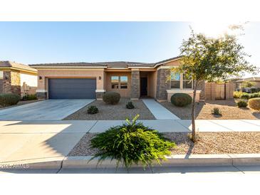 Single-story home with attached garage and desert landscaping at 22643 E Stonecrest Dr, Queen Creek, AZ 85142