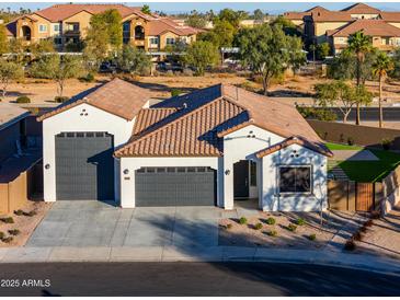 Single-story home with two-car garage, landscaping, and neutral color palette at 2408 N Morrison Ave, Casa Grande, AZ 85122