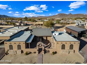 Aerial view of a large property with a main house and outbuildings at 37209 N 12Th St, Phoenix, AZ 85086