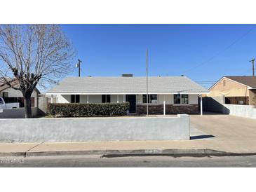 Ranch style home with a well-manicured lawn and updated facade at 5712 N 63Rd Ave, Glendale, AZ 85301