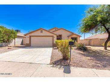 One-story house with attached garage and desert landscaping at 603 W Sierra Vista Dr, Apache Junction, AZ 85120