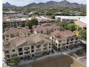 Luxury community near mountains, featuring multiple buildings with Spanish-style architecture at 7275 N Scottsdale Rd # 1001, Paradise Valley, AZ 85253