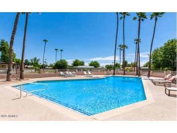 Inviting community pool with lounge chairs at 8013 N Via Palma St, Scottsdale, AZ 85258